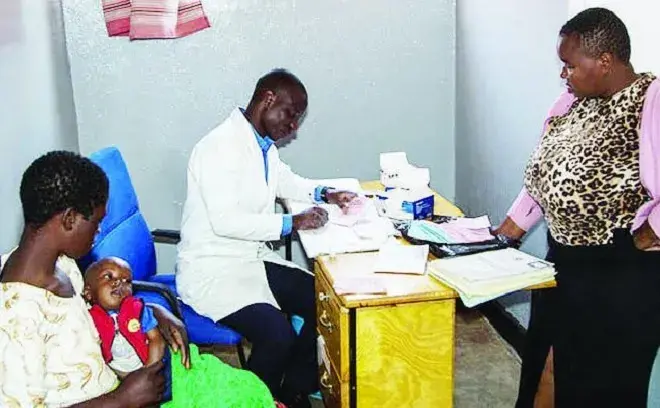 doctor and people around a desk