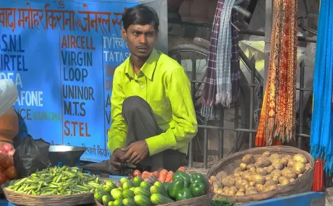 Man selling vegetables